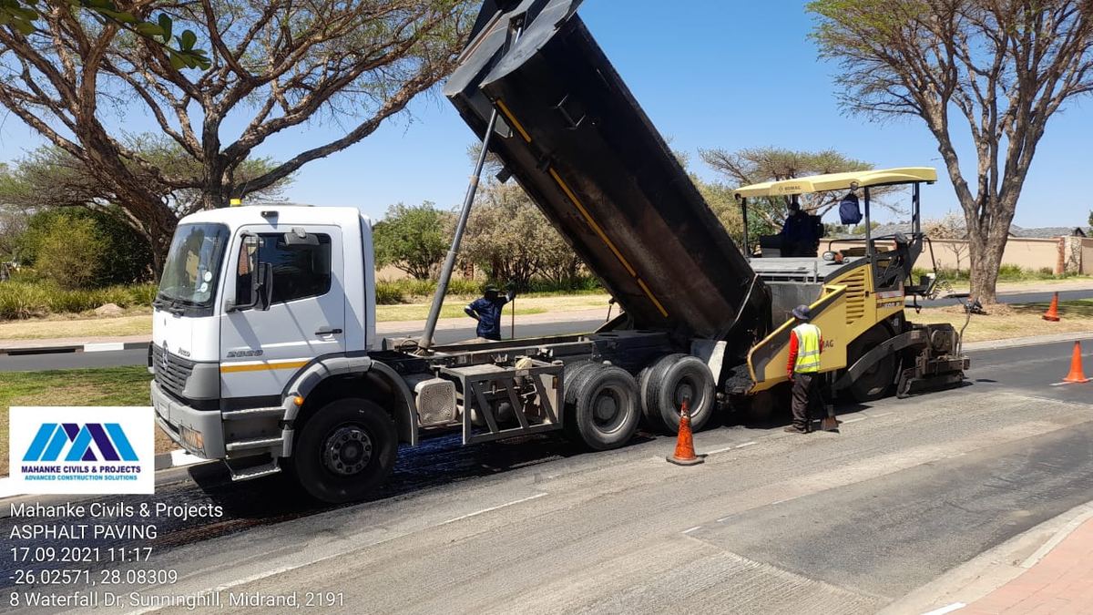 Asphalt delivery into the paver by Mahanke Civils & Projects, Waterfall City, Midrand - 17.09.2021